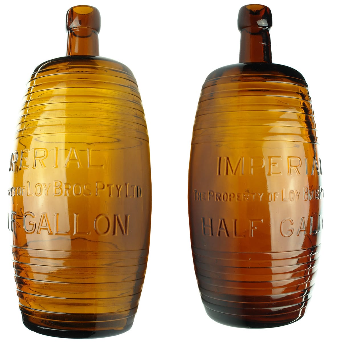 Two Amber glass Barrels, variations. Loy Bros. AGM Glass Maker & UGB Glass Maker. Half Gallon. (Victoria)