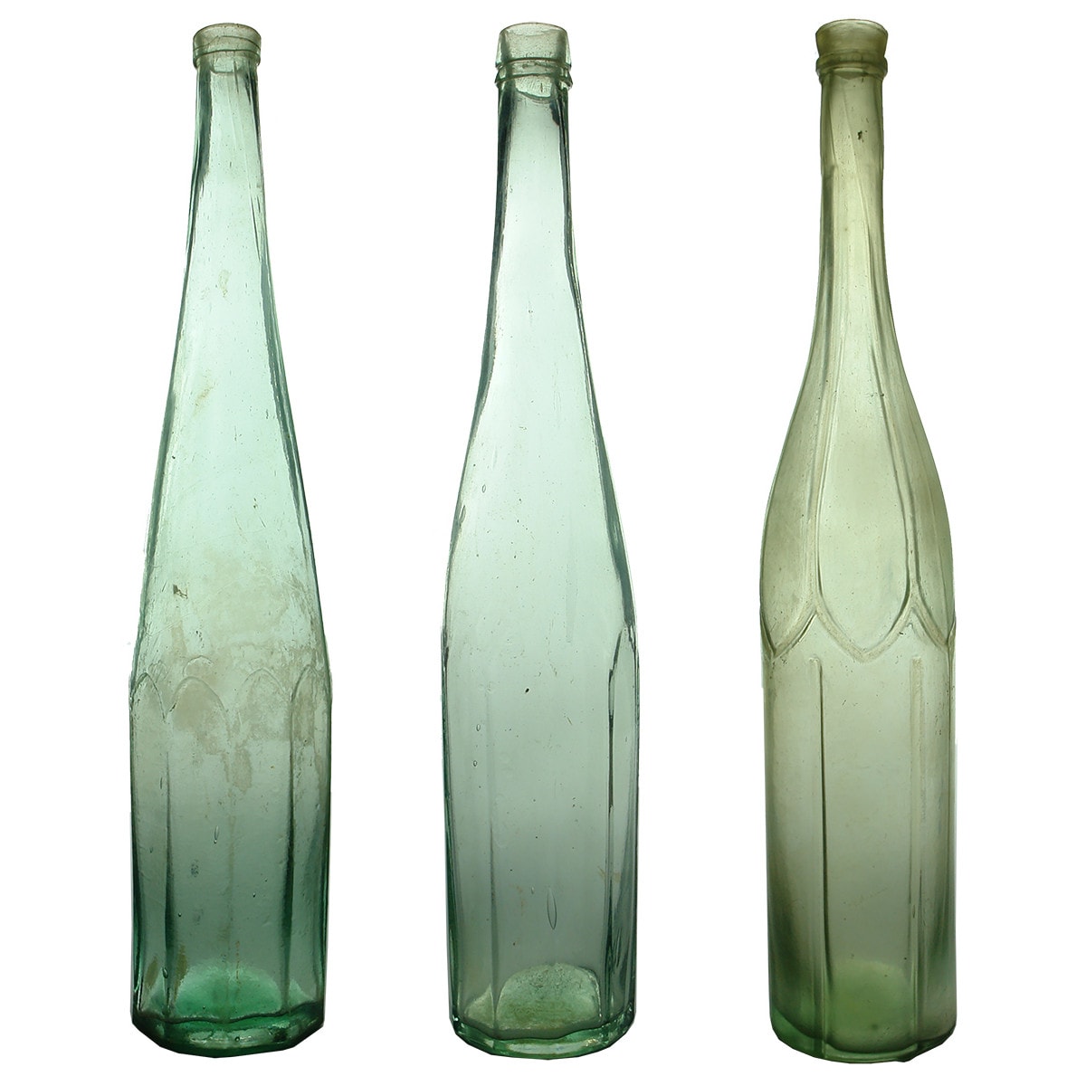 Three Large early Salad Oils. 1. & 2. Both 10 sided. Single & Double collar tops. 3. Six petalled shapes around shoulder. 4 deep grooves vertically up lower section. Aqua. 26 oz.