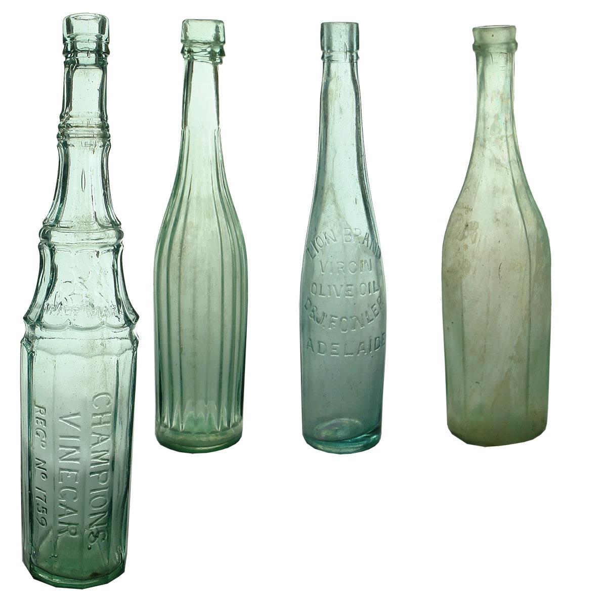 Four Bottles: Champion's Vinegar; Salad Oil; Lion Brand Olive Oil; Goldfields Salad Oil.