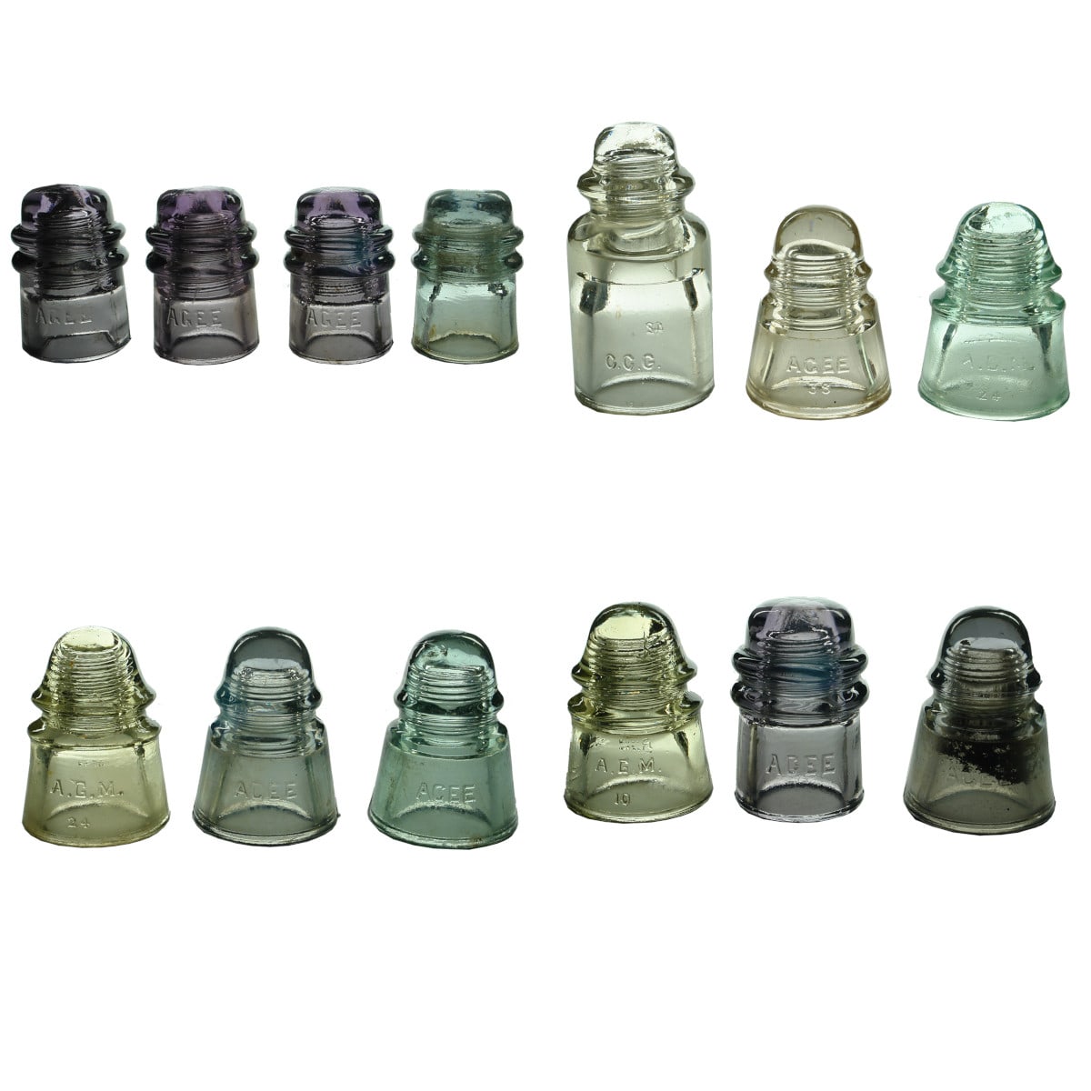 A bakers dozen of Agee, AGM & CCG Insulators. Clear, Aqua & Amethyst. Various types.