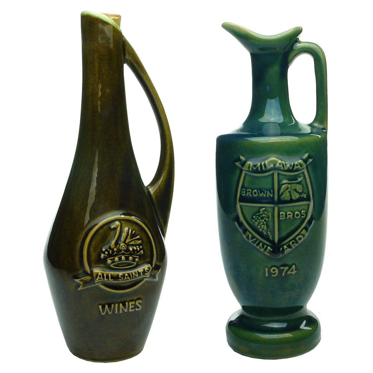 Pair of pottery wine decanters: All Saints Wines and Brown Bros. Milawa Vineyard. (Victoria)