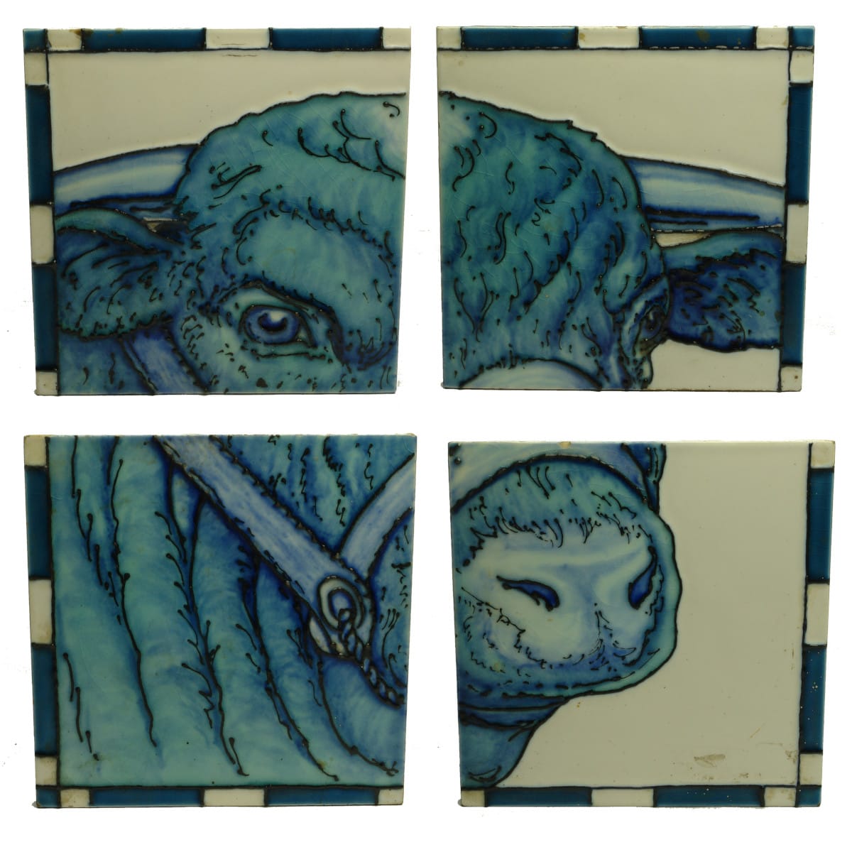 Tiles. Set of four bull's head tiles from a butcher's shop.