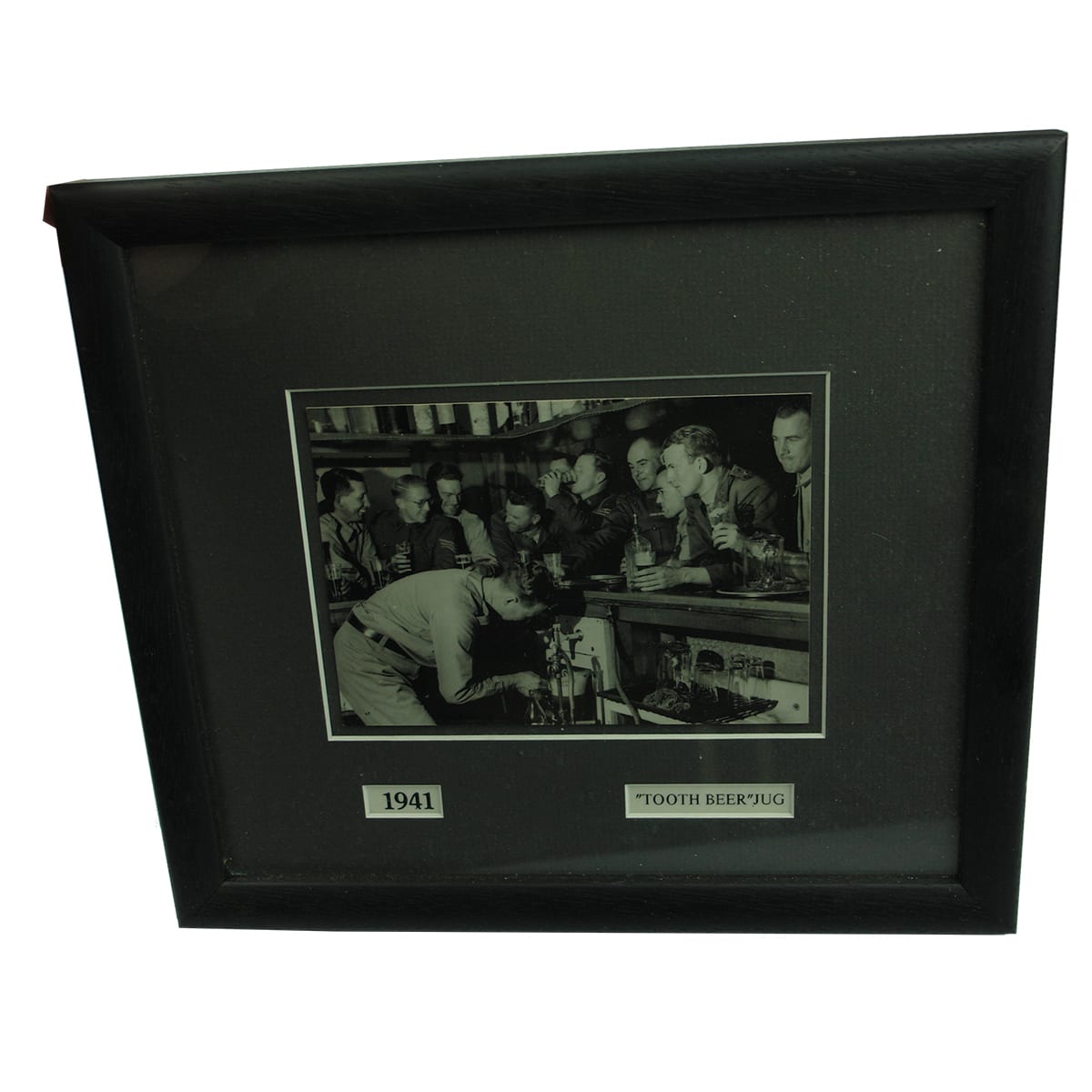 Framed Photograph. 1941. Soldiers drinking beer. Marked Tooths Beer Jug being filled. (New South Wales)