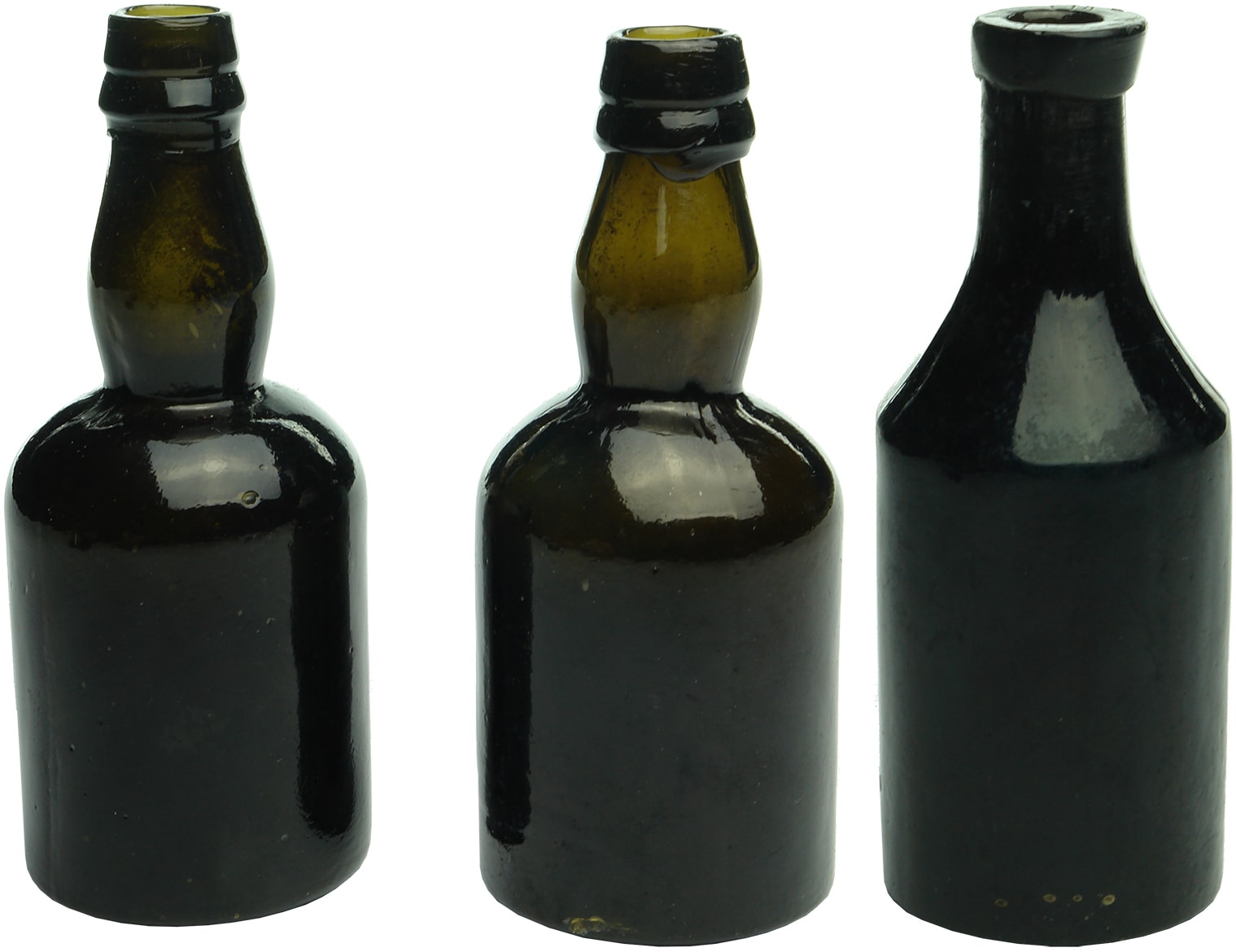 Three sample black glass bottles