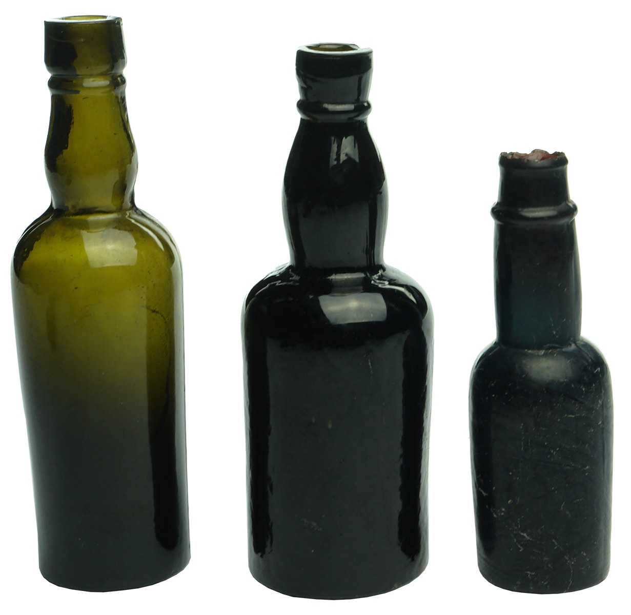 Three sample black glass bottles
