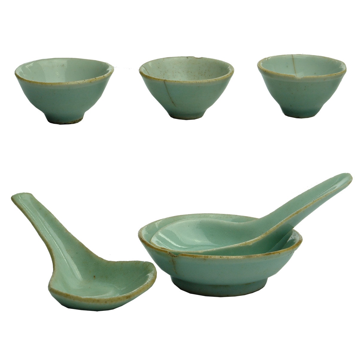 Seven Chinese Items: Four little blue finger bowls, pair of soup spoons and a small dish.