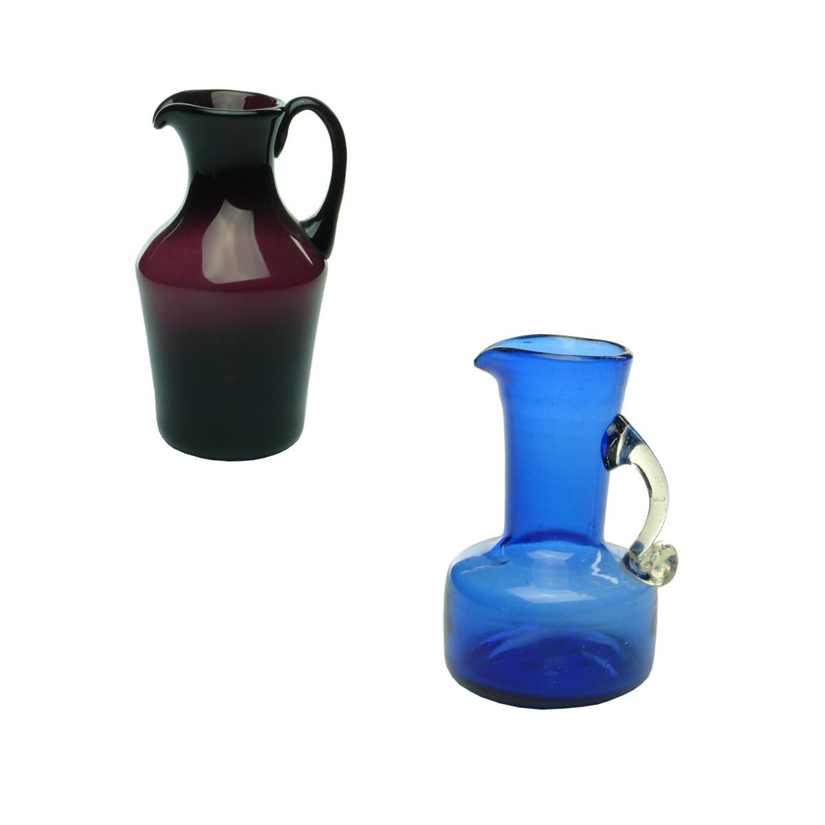 Early Glass. Two Jugs. Purple pouring jug with handle and a Blue pouring jug with clear handle. Pontils.