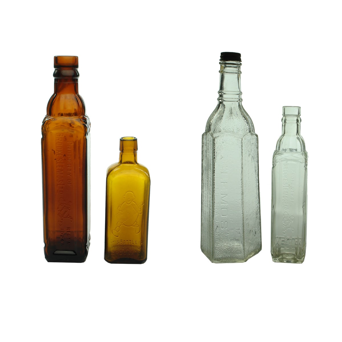 Four Brooke's Lemos bottles. Amber & Clear. Lemon man. (Victoria)