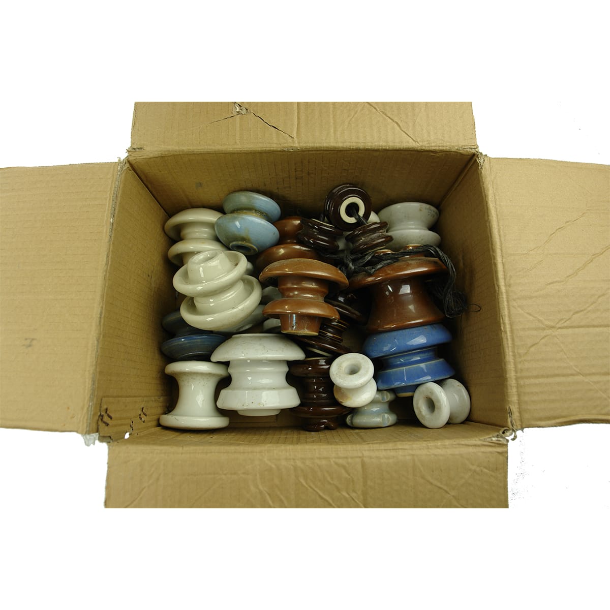 22 Porcelain Insulators. Variations of "Cotton Reel" type shapes. Lots of different colours, markings etc.