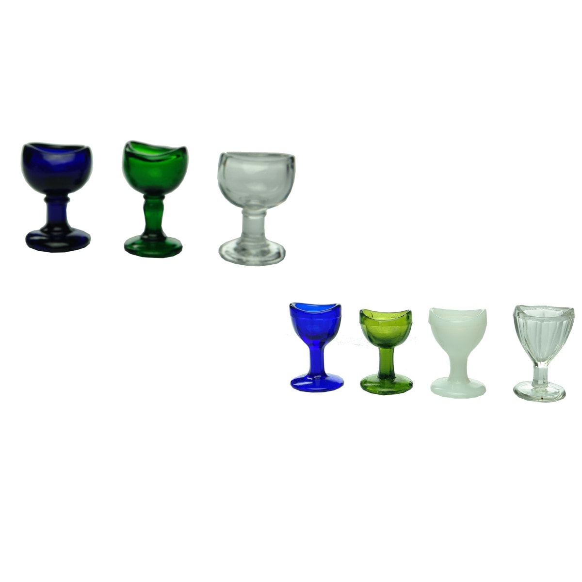 7 Eye baths: 1. - 3. Green, Cobalt & Clear. 2 x Wood Bros.  4. - 7. Four pedestal eye baths with facetted bowls: Clear, Cobalt, Green & Opal or Milk Glass.