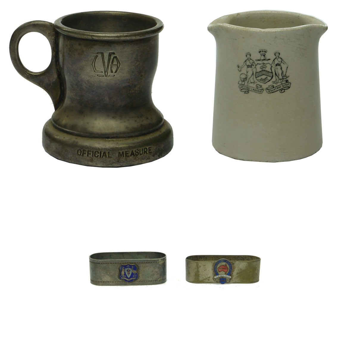 4 small Items: Metal Official Measure; Pair of NSW 150th Serviette Rings; Fowler Coat of Arms Milk Jug.