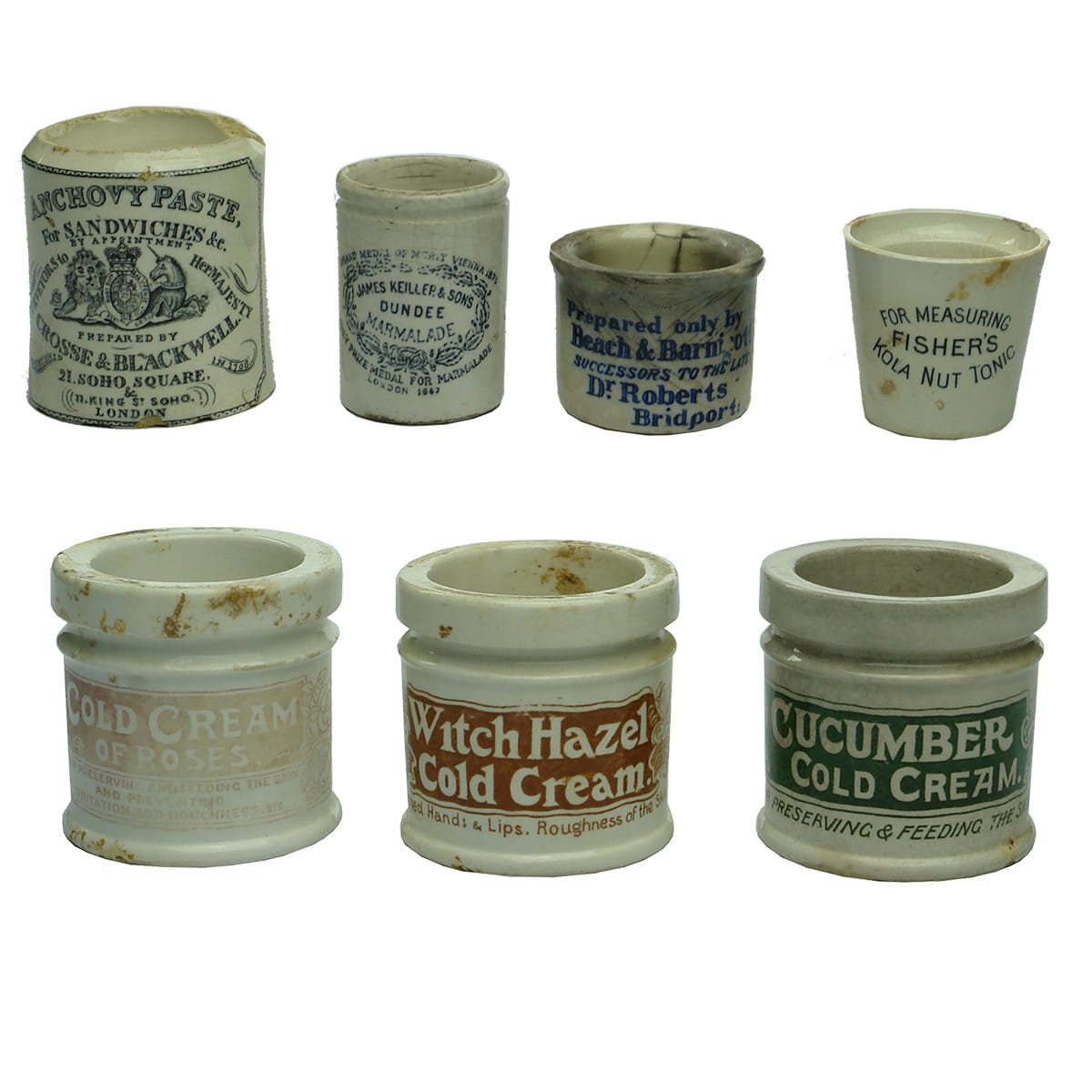 7 small stoneware jars: Sample Keiller Marmalade; Fisher's Kola Tonic; Poor Man's Friend; 3 x Cosmetics; Anchovy Paste.