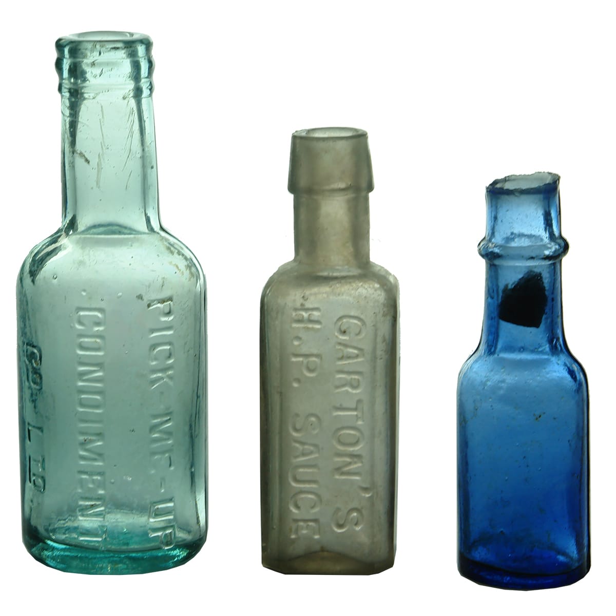 Three Sample Bottles: Pick Me Up Sauce; Garton's HP Sauce; Castor Oil.