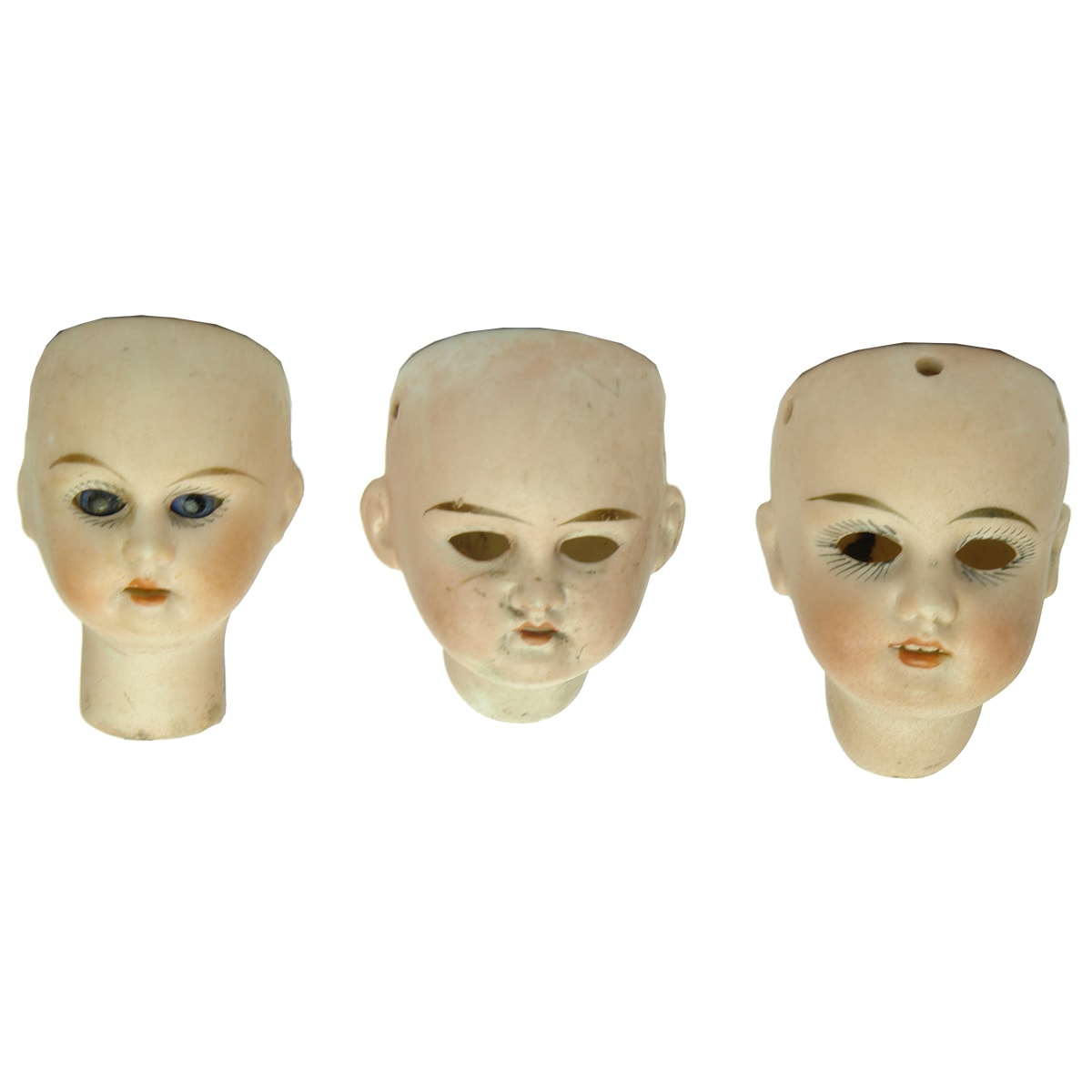 Dolls. Three different German bisque doll's heads.