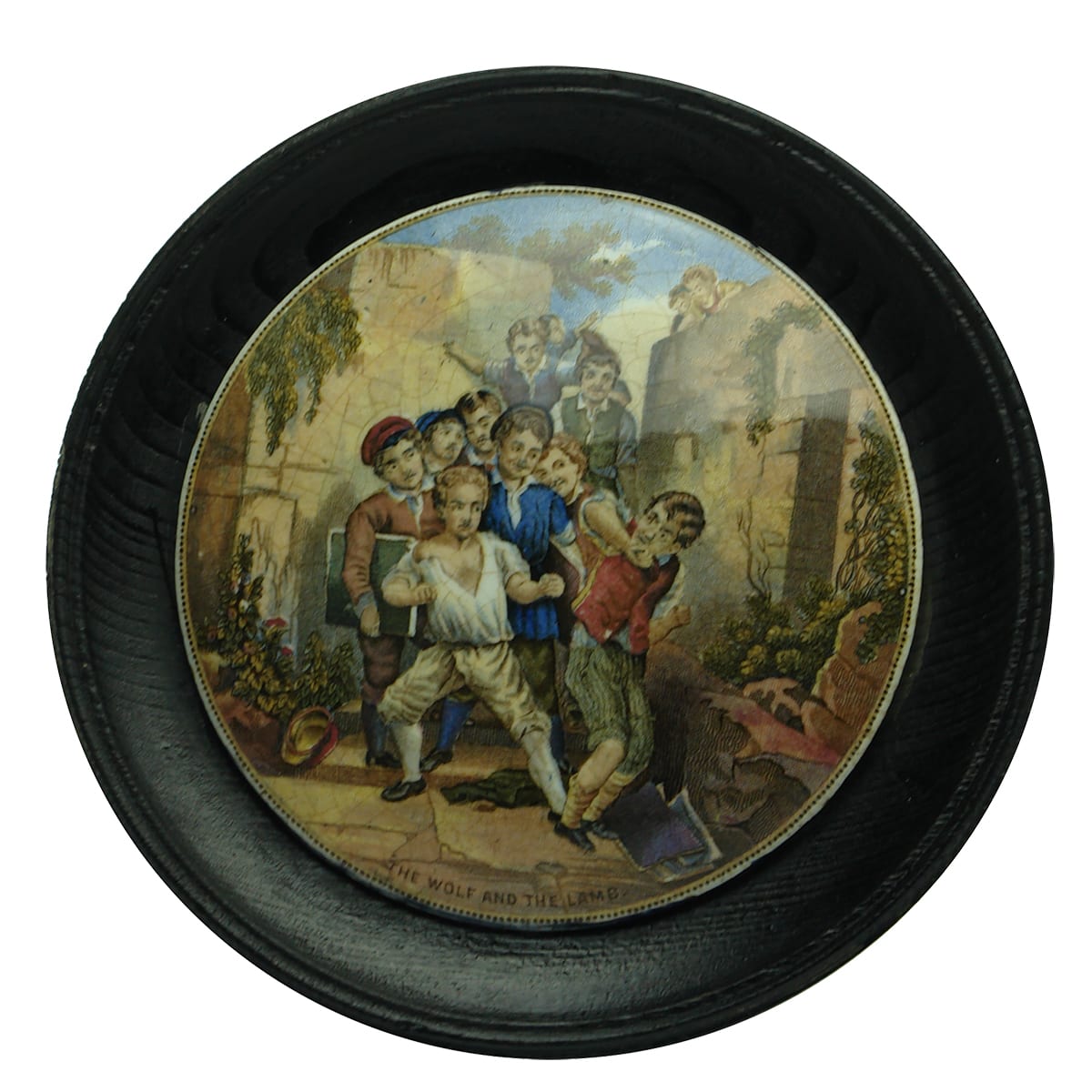 Prattware Pot Lid. The Wolf and the Lamb. In an early wooden frame.