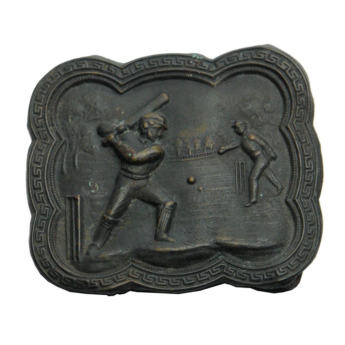 Cricket Belt Buckle. Bowler, ball on the way and Batsman winding up to hit.