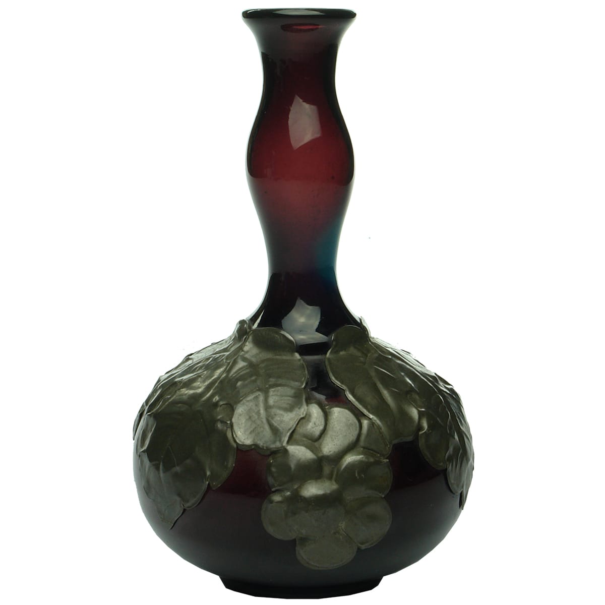 Purple glass decanter. Laid on pewter decoration of grapes and vine leaves. Polished pontil scar to base.