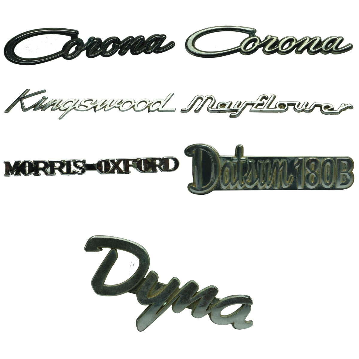 Garagenalia. Seven Car Badges: Corona x 2; Kingswood; Mayflower; Morris Oxford; Datsun 180B; Dyna.
