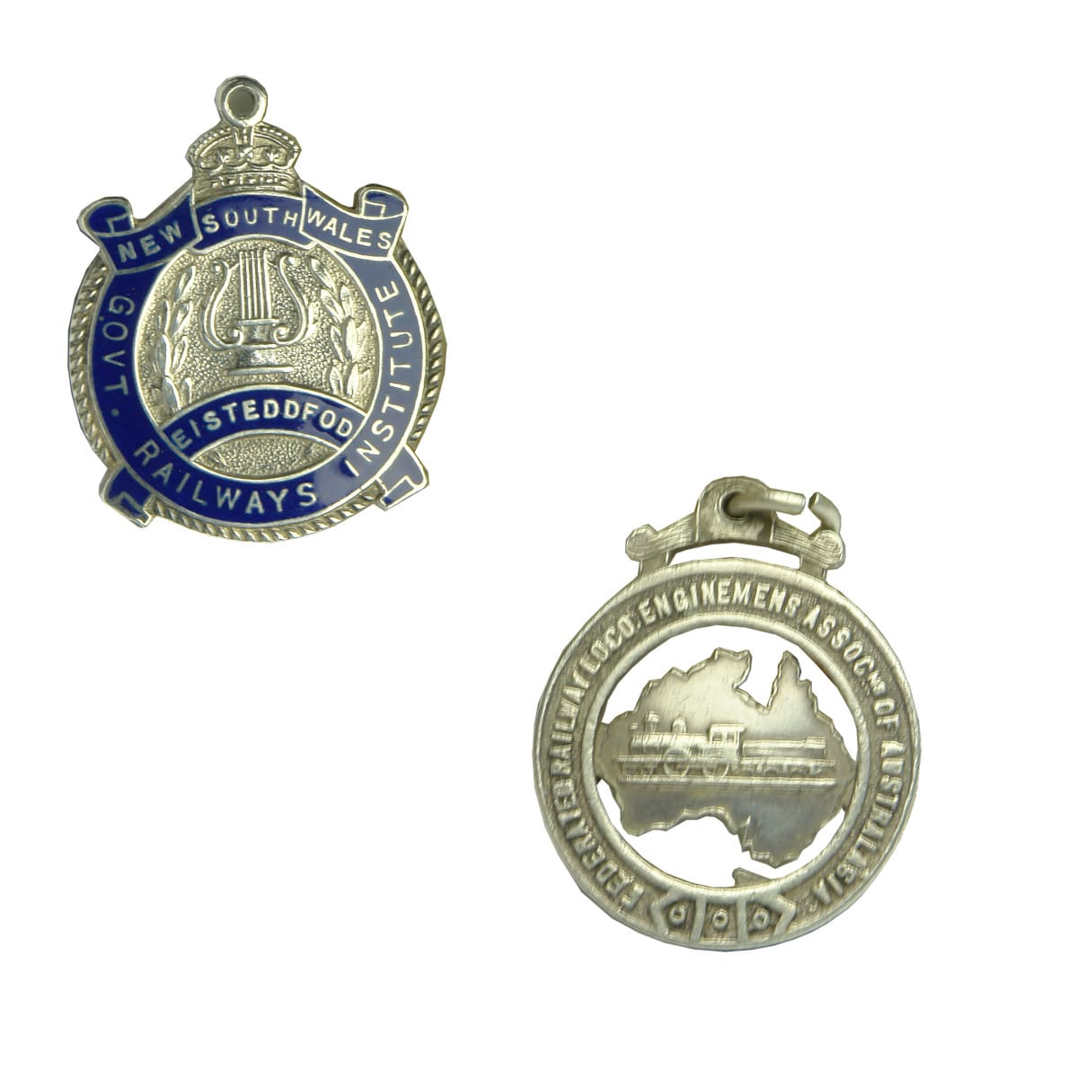 Two silver Railway related Badges: NSW Govt. Railways Institute Eisteddfod and Federated Railway Loco Enginemens Association.