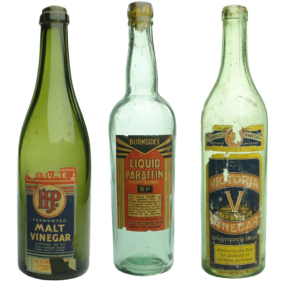 Three labelled Bottles: Pulfer, Bendigo Vinegar; Burnside's, Melbourne Paraffin; Victoria Vinegar, Vickery, Ballarat & Melbourne. (Victoria)