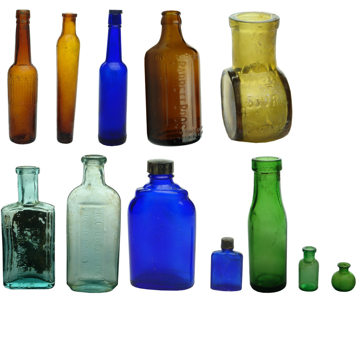 12 Bottles. Amber Lewis & Whitty Castor Oil; amber lavendar water; Henry Berry blue castor oil; Barrett glass Ginger Beer; Bovril: etc. etc.