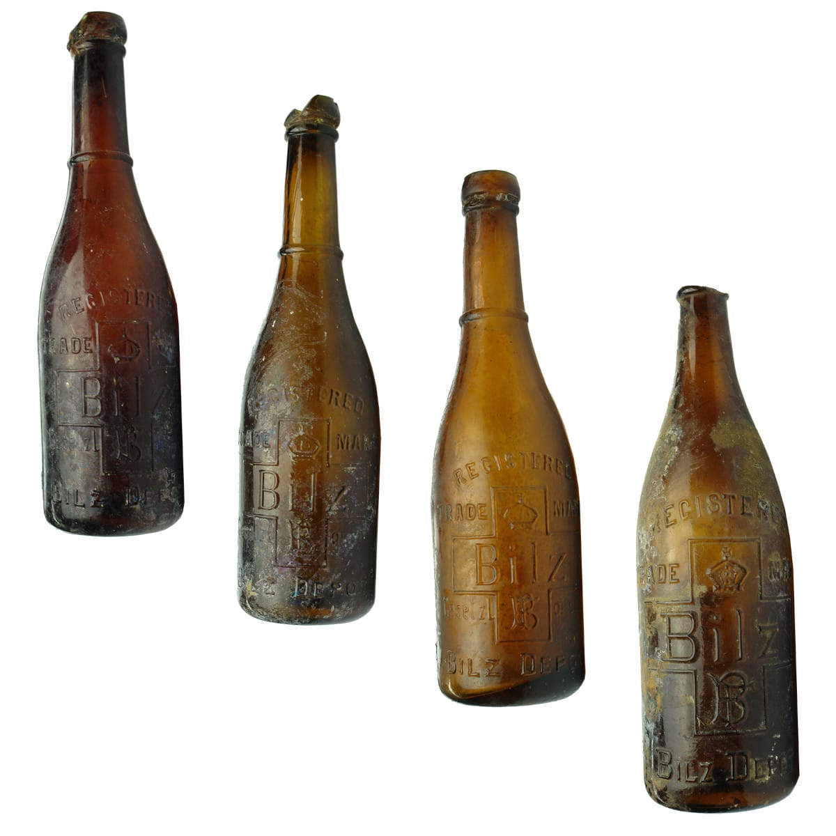 4 Bilz Depot Bottles. 3 small size in different amber colours and one large size. All damaged. (Victoria)