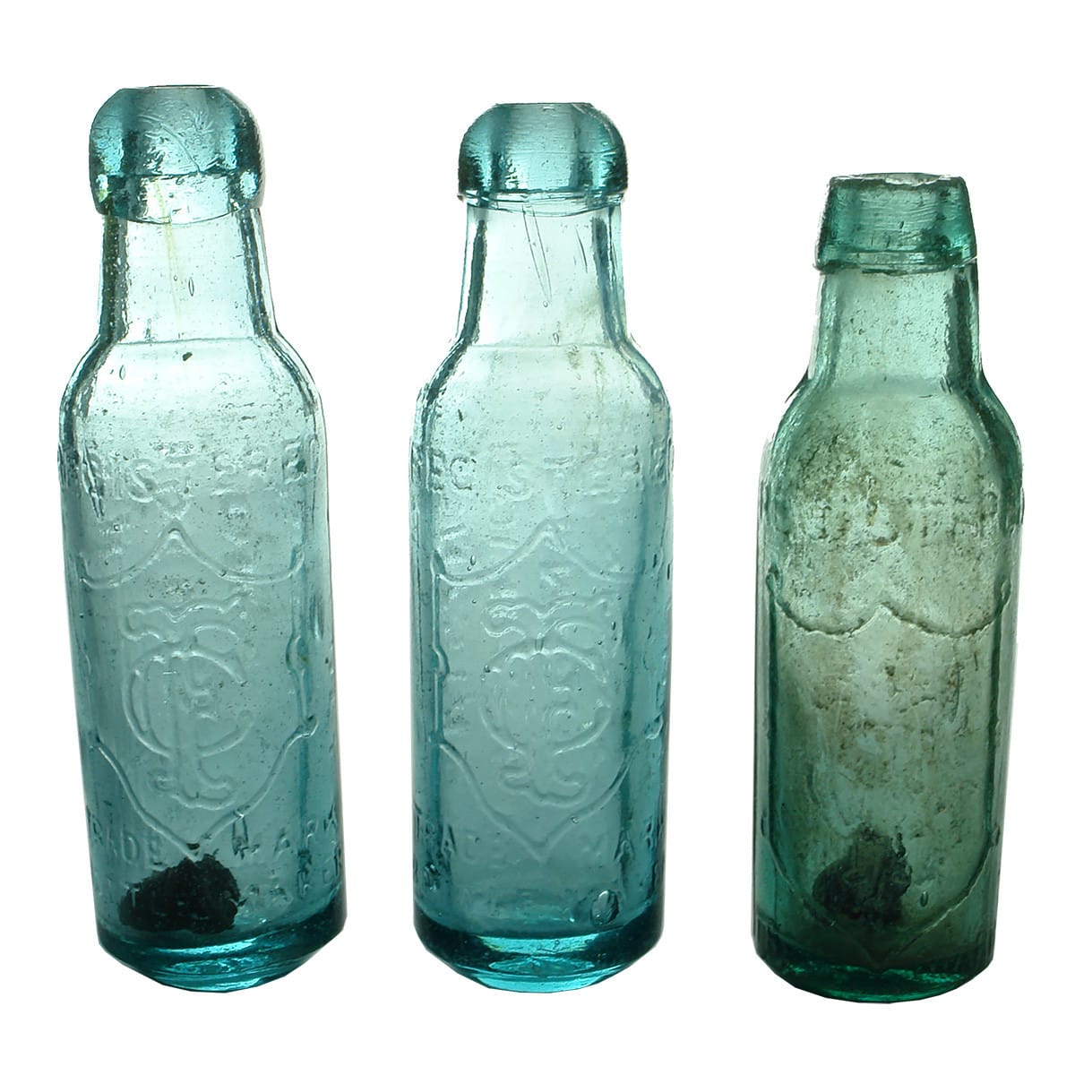 Three Crystal Fountain Bottles: 2 Bluish J. Ross maker bottles; Smaller greenish one with N. S. W. embossed near the base edge. (New South Wales)