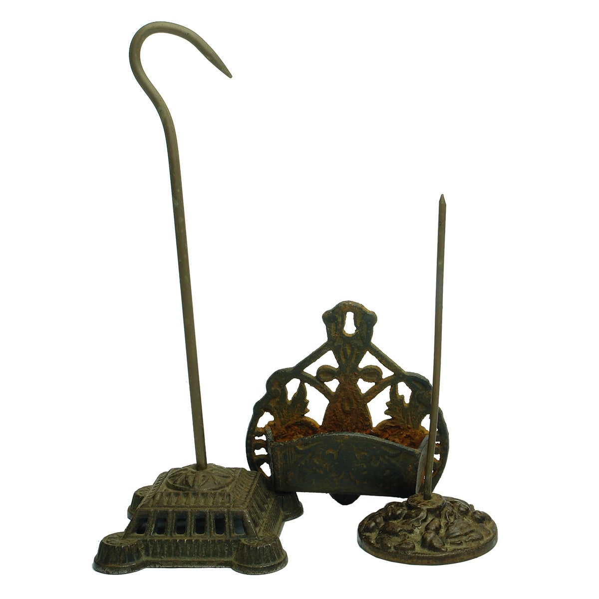 Metalware. Two cast iron bill spikes and a wall mount match holder and striker.