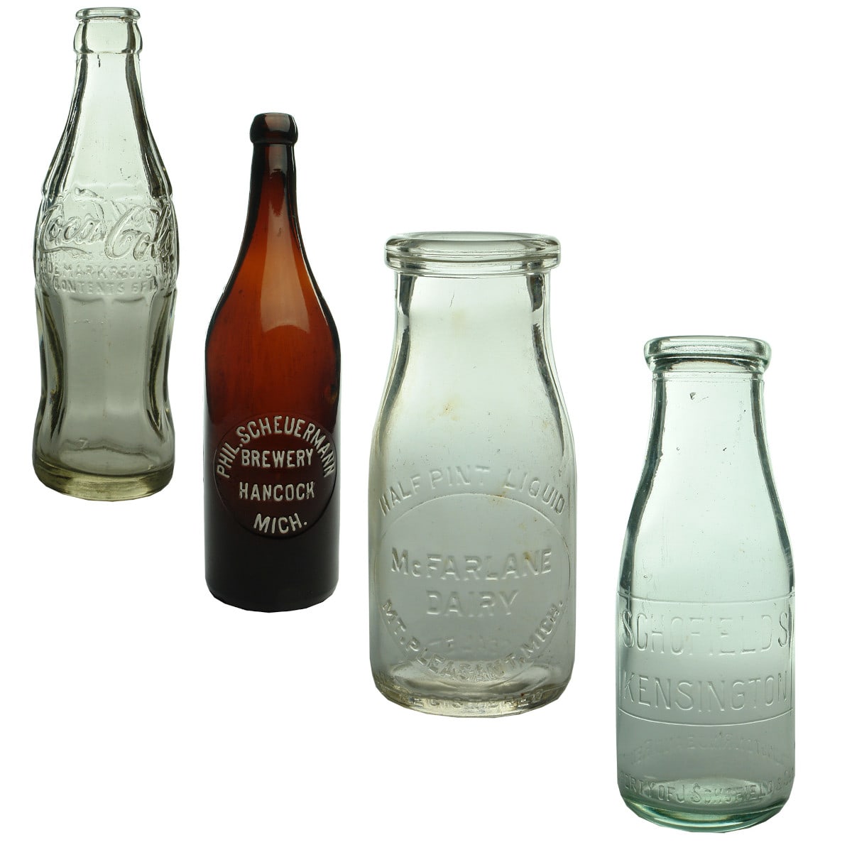 Four Bottles: Coca Cola; Phil Scheuermann Brewery; McFarlane Dairy; Schofield's Kensington Milk.