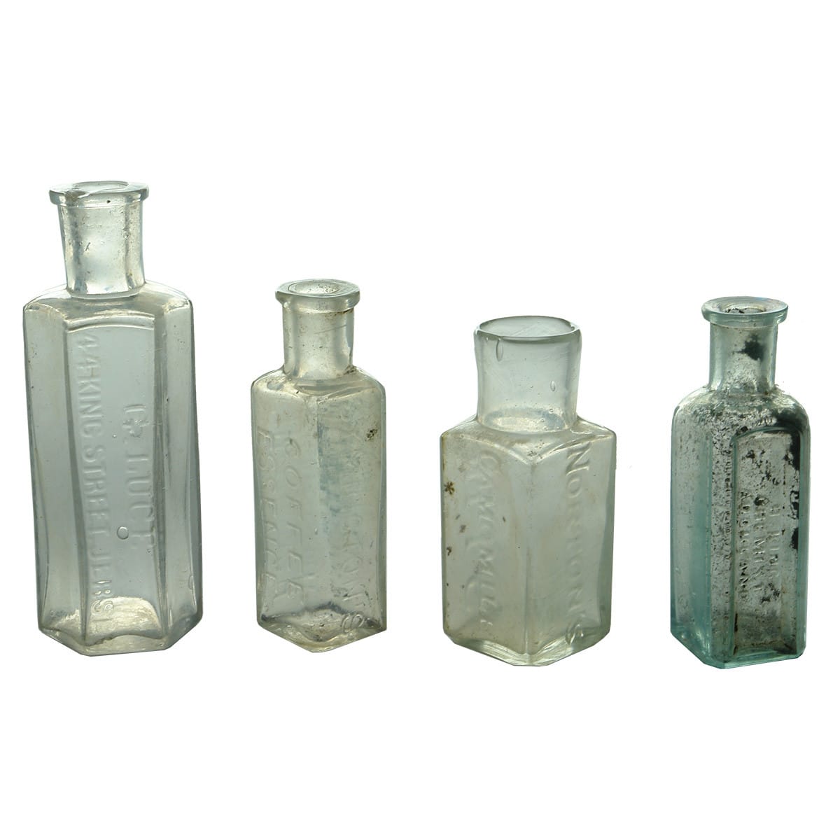 Four small bottles: G. Luce, Jersey; Sample Symington Coffee; King, Chemist, Auckland; Norton's Camomile Pills.