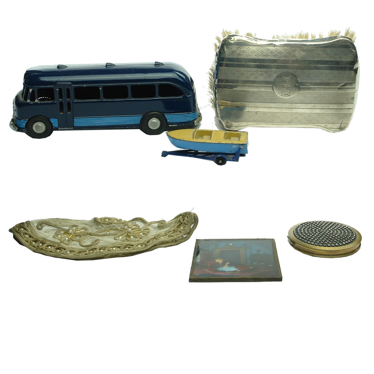 6 Widely varying items! Model bus; Model boat on trailer; Brush with initials engraved; Coloured glass frame; Lace item; Brass makeup case loaded with "Diamonds!"