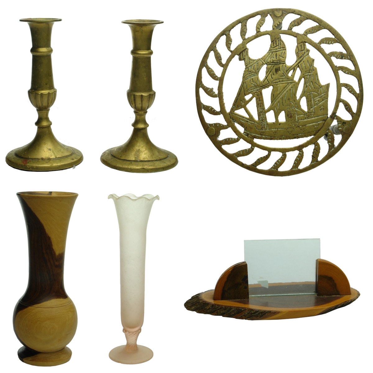 Six items: Pair of brass candlesticks; Brass Trivet with Ship; Turned wood vase; Tall frosted pink glass vase; Mulga wood picture holder with two pieces of glass.