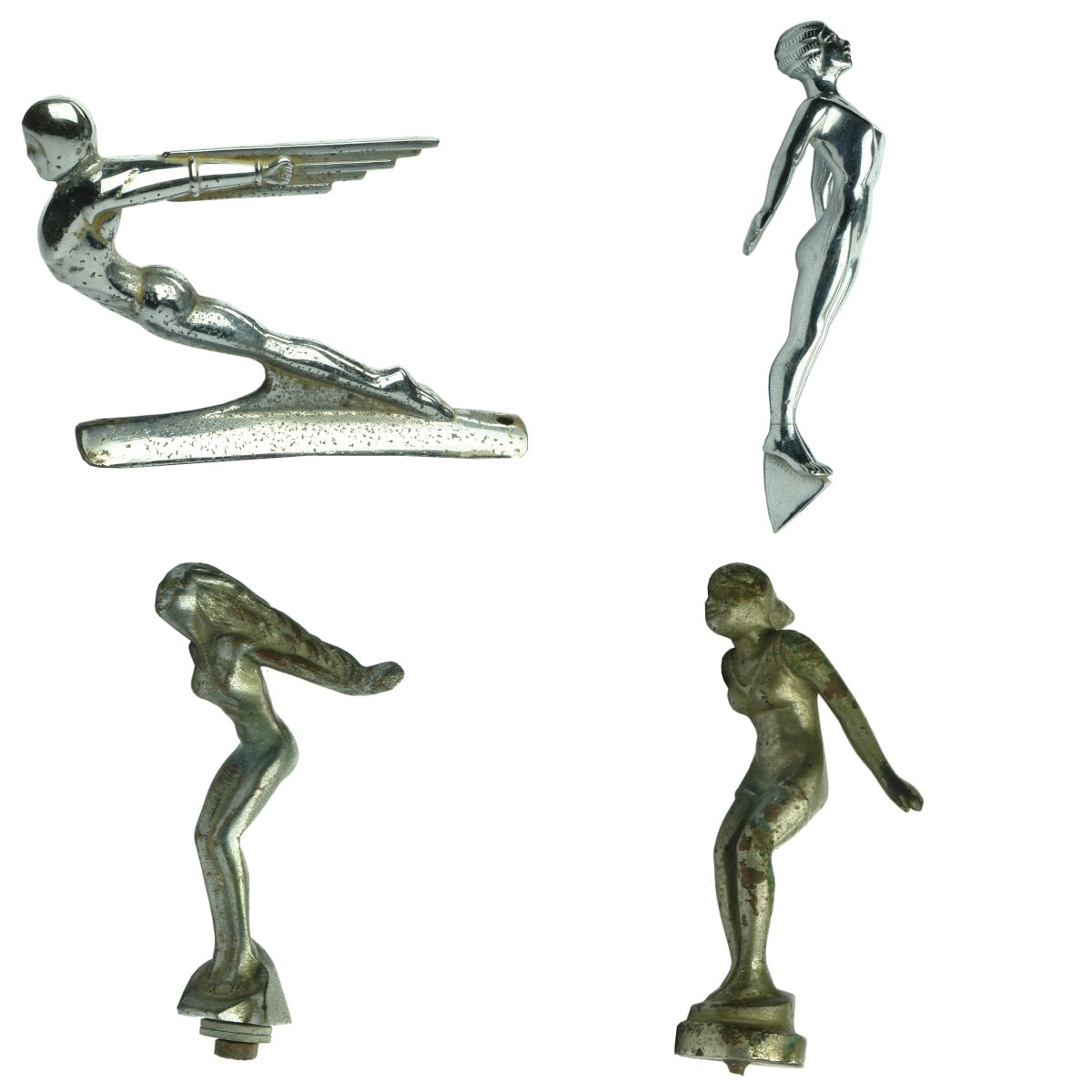 Four Metal Hood Ornament type items. 2 with Chrome finish and 2 that are duller. All different.