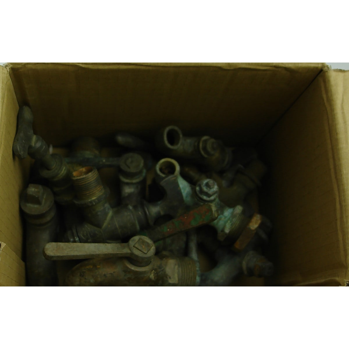 One dozen medium to large brass taps. Various mechanisms and types.