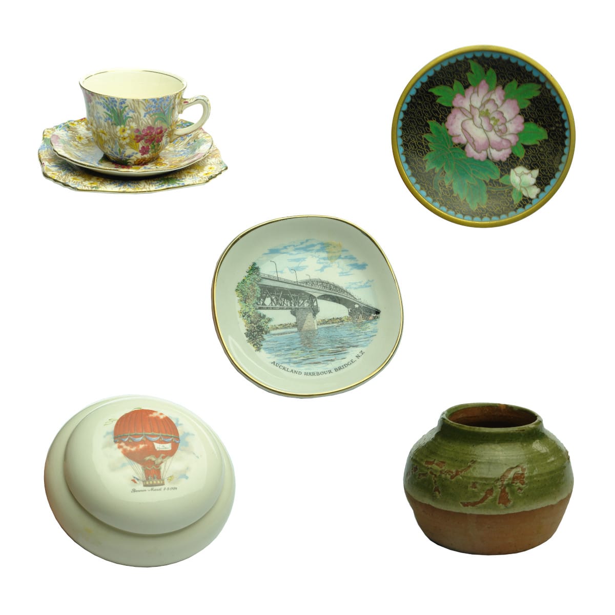 Five items or groups: Royal Winton Marguerite Trio; Chinese Brass plate with enamel decoration; Auckland Harbour plate; Hot Air Balloon ceramic jar and lid; Small pot, Kilgour or similar on base.