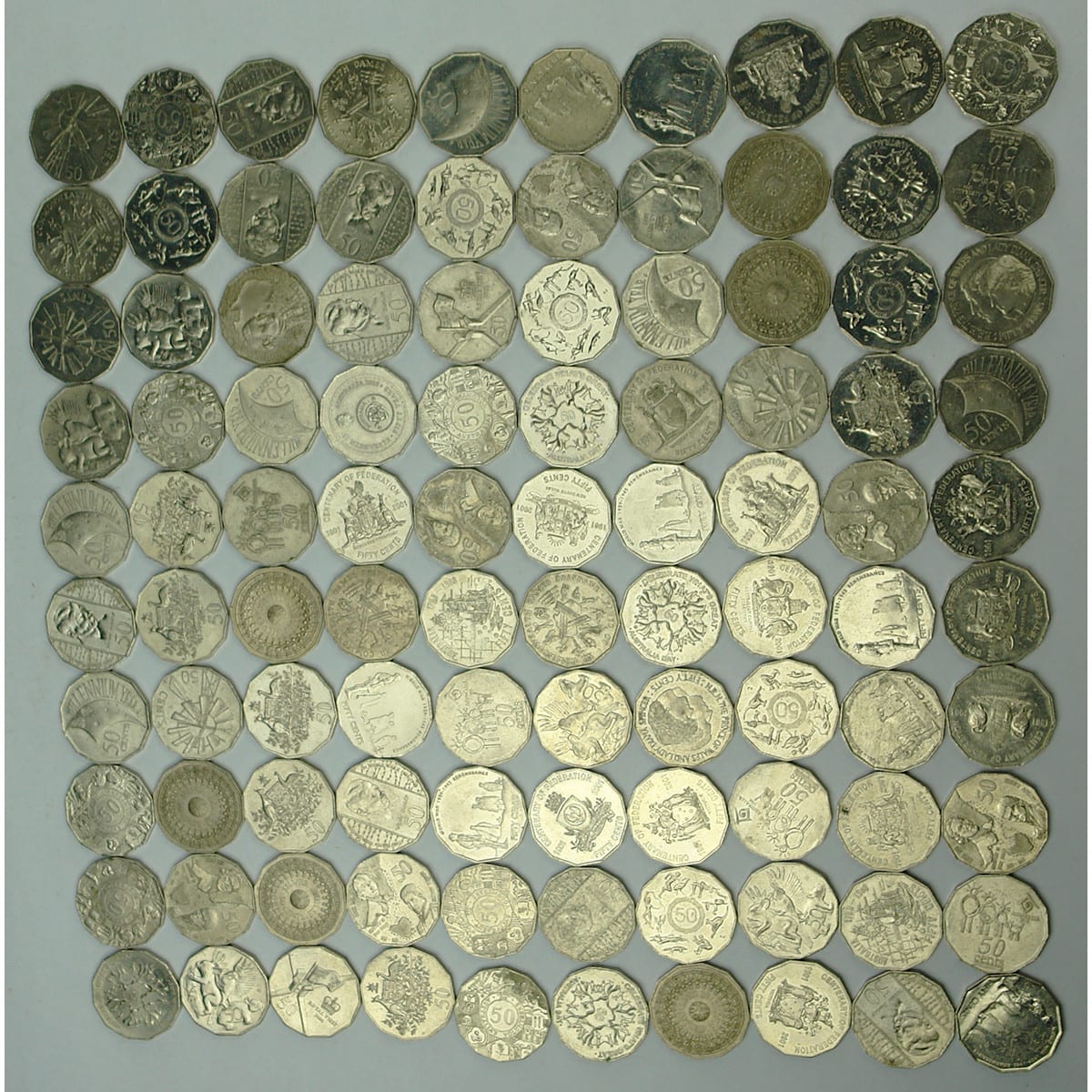 Coins. 100 x commemorative Australian 50 cent coins.