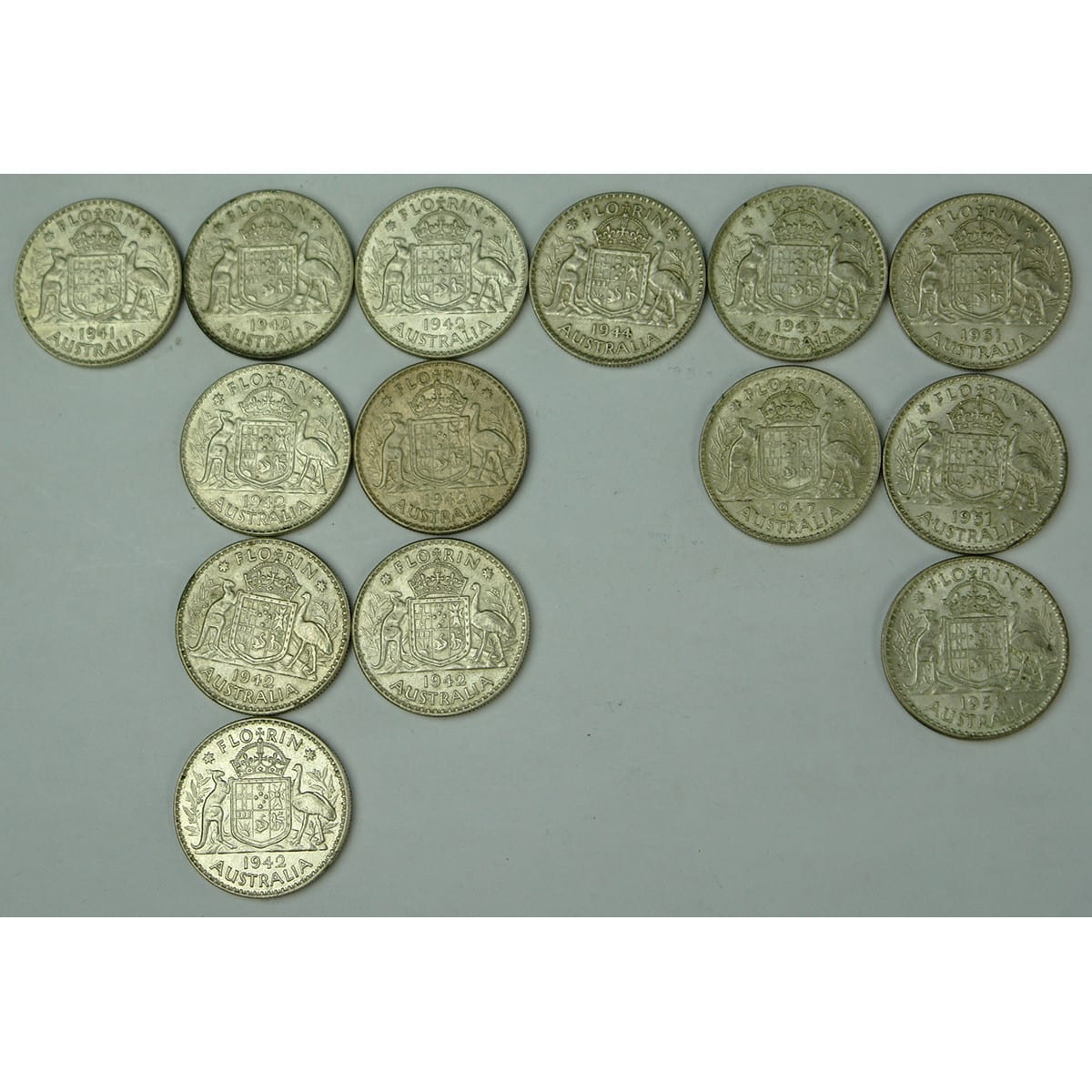 Coins. 14 Australian Florins: 1 x 1941, 7 x 1942, 1 x 1944, 2 x 1947 and 3 x 1951.