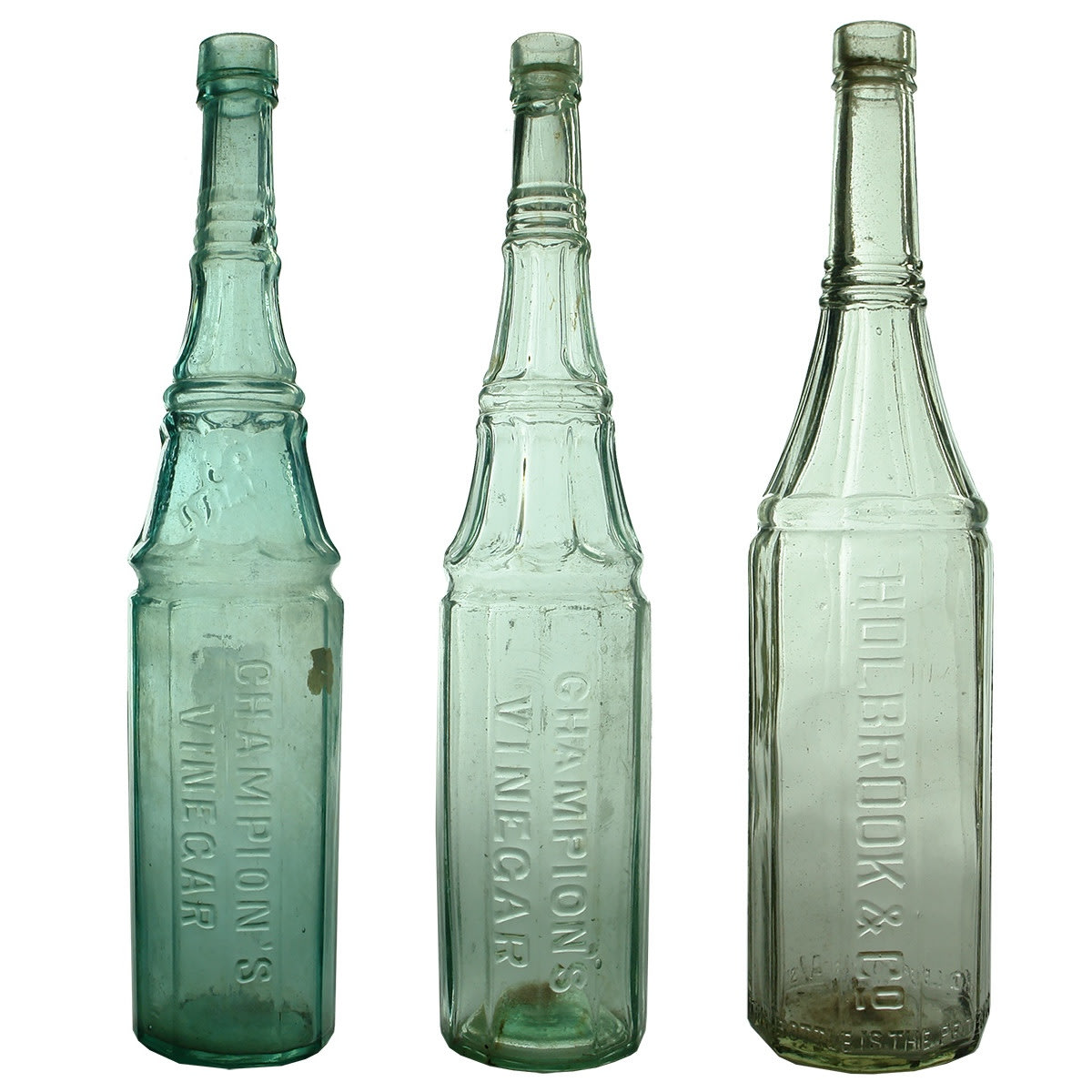 3 Vinegar Bottles. 2 x different Champion's Vinegar and 1 x Holbrook & Co.