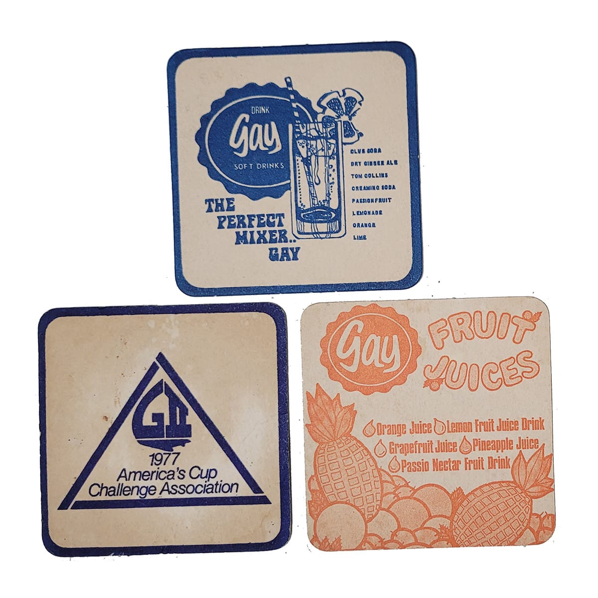 3 Coasters. Gay Soft Drinks and Gay Fruit Juice. One with America's Cup 1977 Gretel II promotion. (Newcastle, New South Wales)