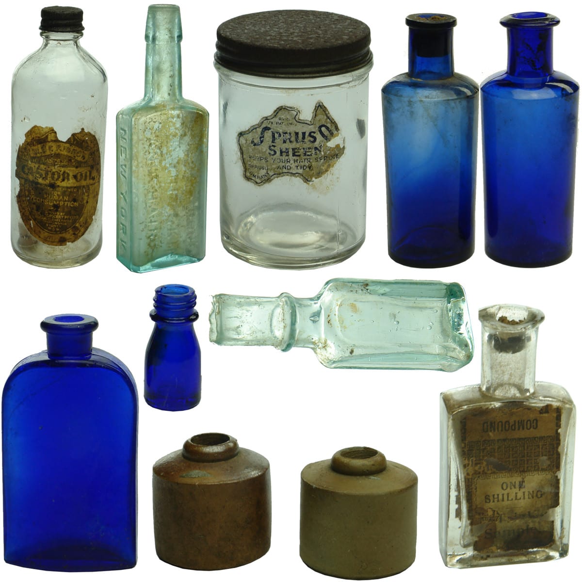 11 small bottles: Blue Ribbon labelled castor oil; Tricopherous; Spruso; Penny inks; 4 Cobalts; Specimen case; Mini shear lip rectangular.