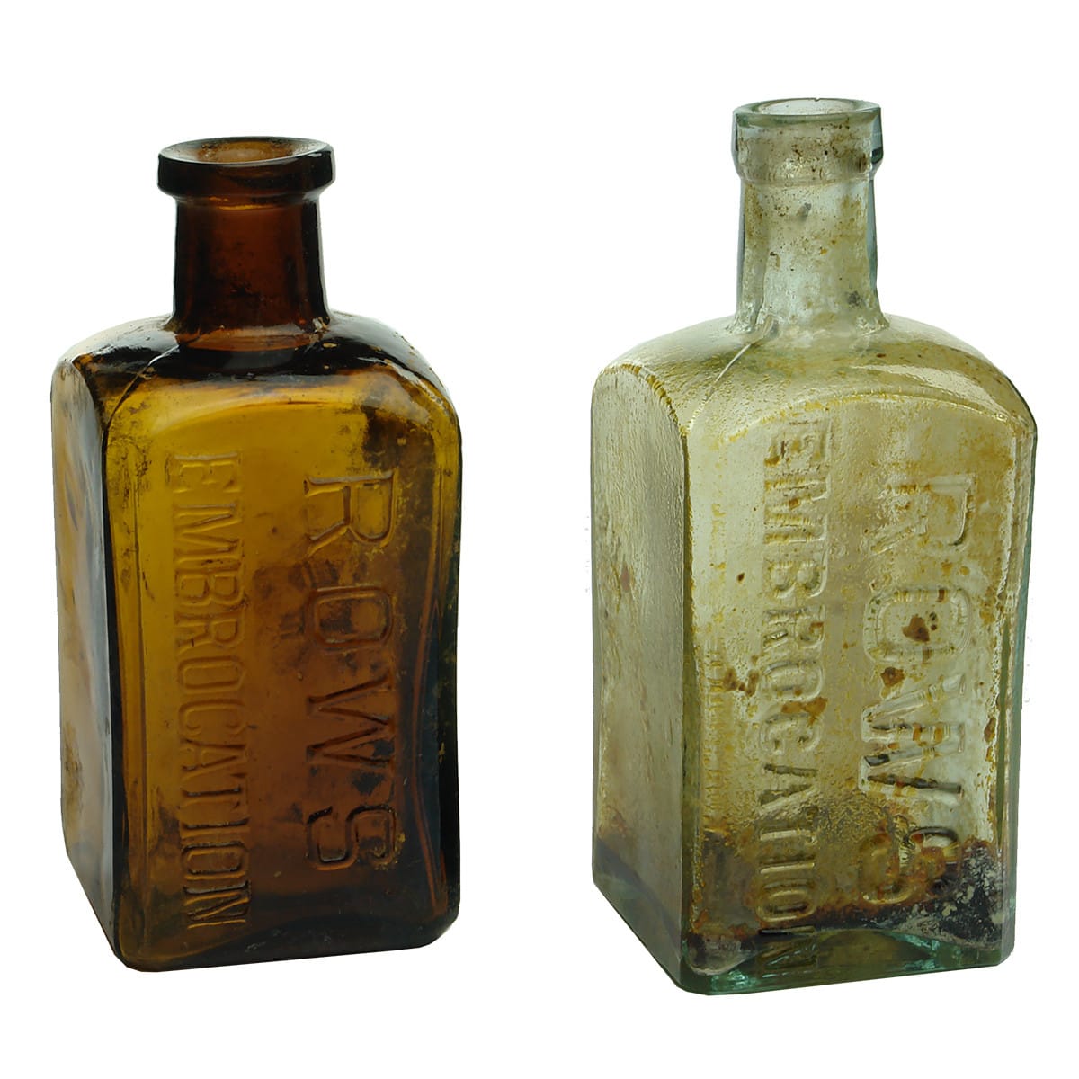 Pair of Rows Embrocation bottles. Aqua & Amber.