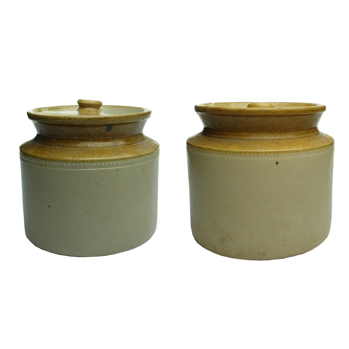 Pottery. Pair of lidded crocks, large is 3 quart.