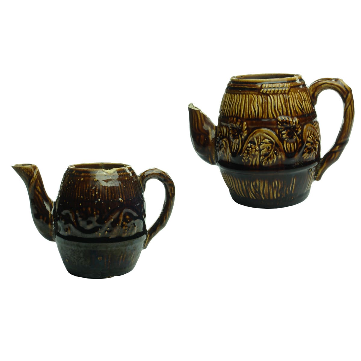 2 Teapots. Barrel shapes with Grapes & Vines around the middle. 1 Cup and 2 Cup sizes. Rockingham Glaze.