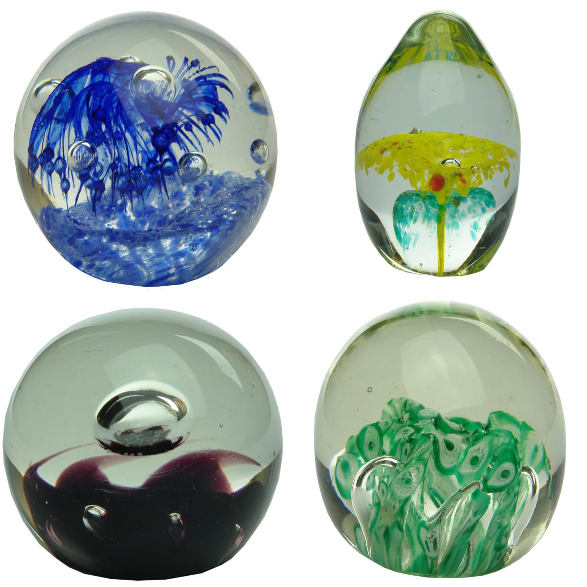 4 Glass Paperweights. Blue & White "Starburst"; Pointy egg shape Yellow & Green; Queen Elizabeth II Jubilee; Oval Green & White Candy Cane.