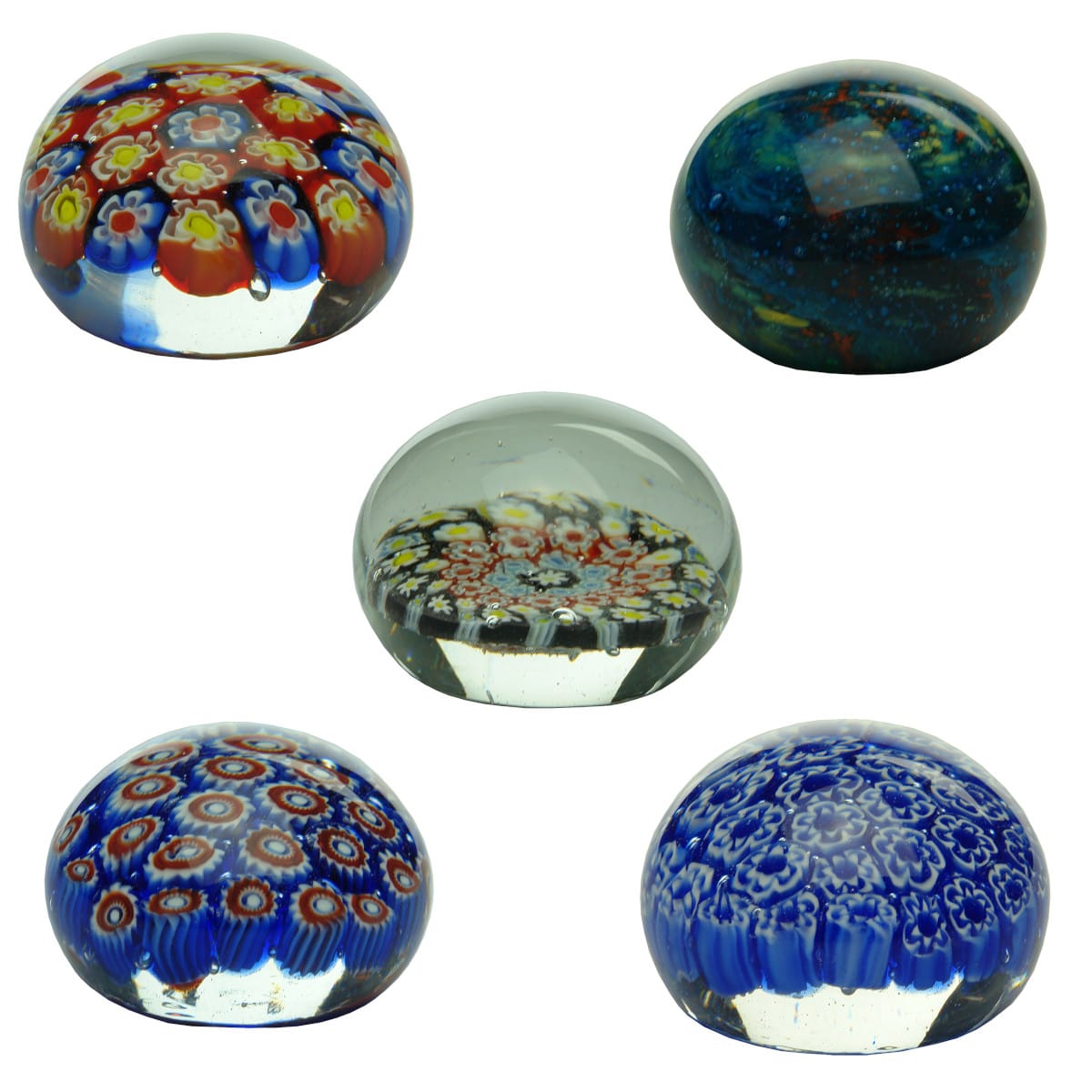5 Glass Paperweights. Multi-coloured canes; Galaxy like; Black, red, blue & yellow; red, white & blue; Blue & White.