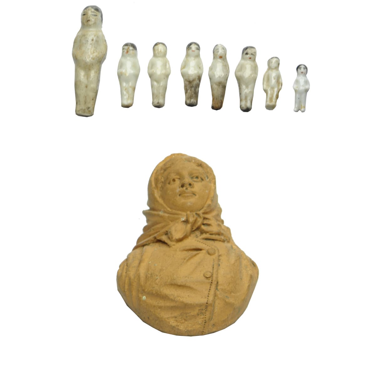 9 Dolls. 8 pudding dolls in 4 sizes and a Terracotta bust of shawled lady.