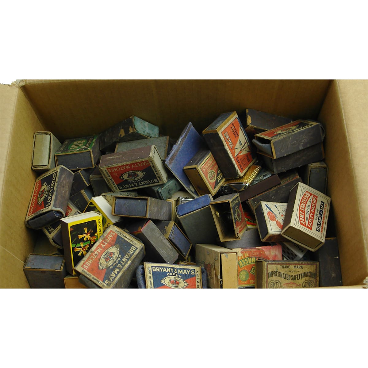 Box of Matchboxes and matchbox labels. Lots of early ones right through to later advertising ones. A couple of lighters and a Buchan souvenir matchbox holder too.