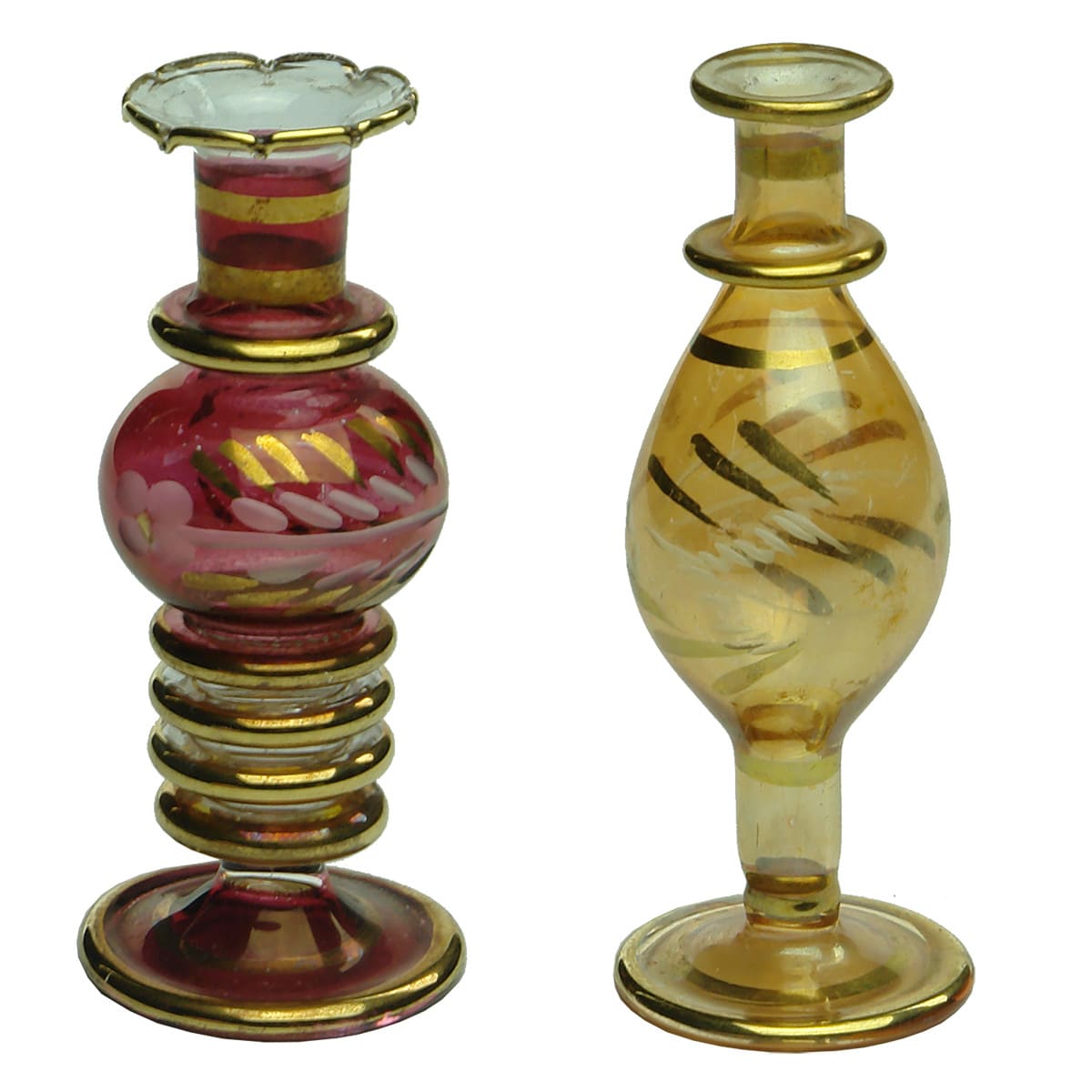 Perfume. Pair of late 19th century lightweight ornate perfumes with gold leaf design, one ruby, the other has a copper appearance.