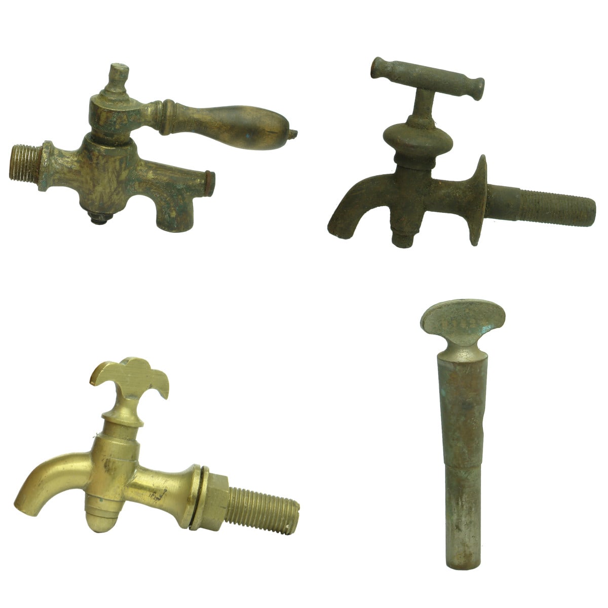 Metalware. Three early brass taps and a tap handle.