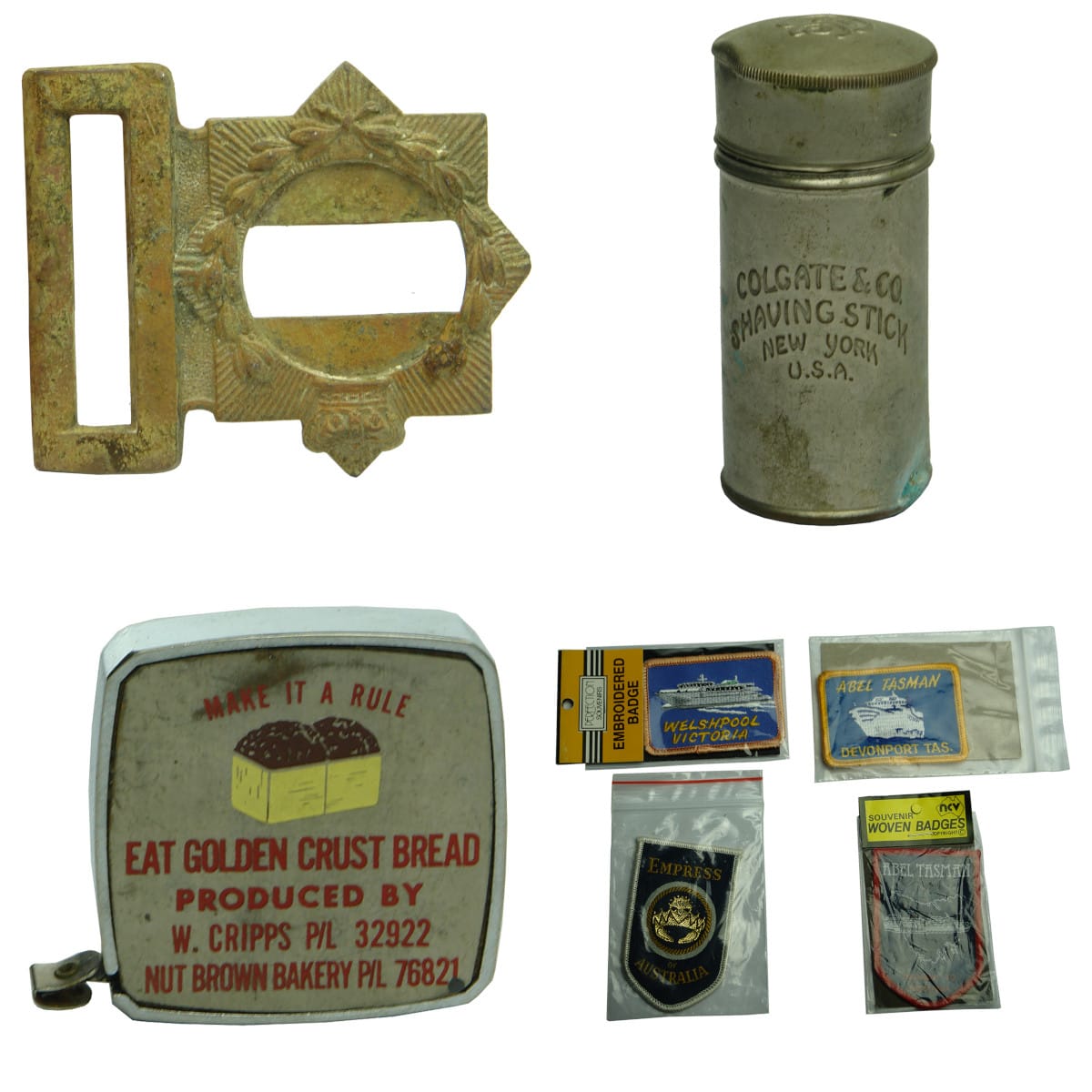 7 Items: Belt buckle with Crown & Wreath; Colgate Shaving Stick Tin; Cripps Hobart advertising tape measure; 4 Souvenir Cloth badges.